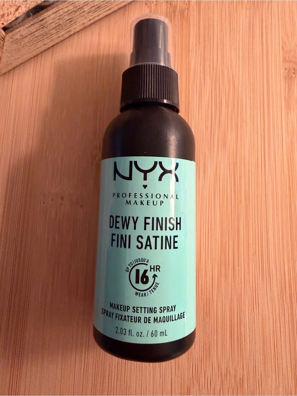NYX Professional Makeup setting spray provides a dewy finish